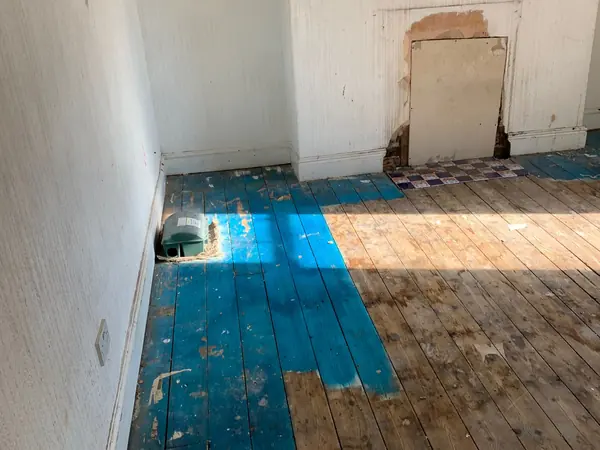 The same house emptied room by room