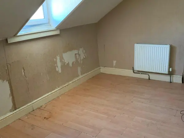 The same house emptied room by room