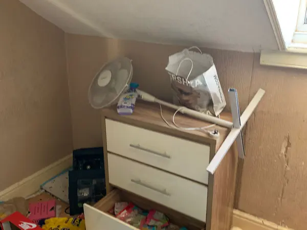 Cluttered house before clearance
