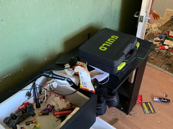 Cluttered house before clearance